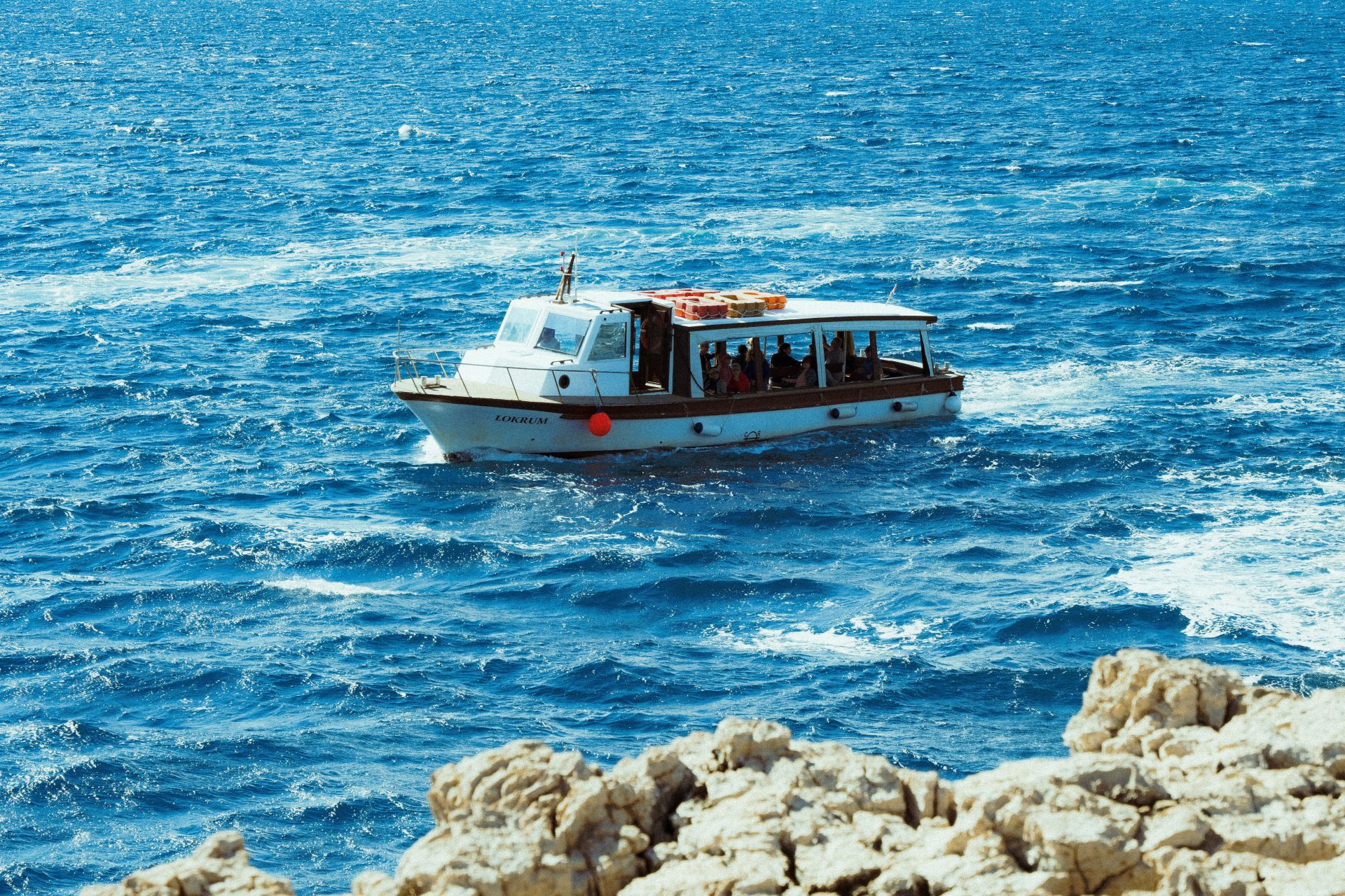 A small boat in the middle of the ocean